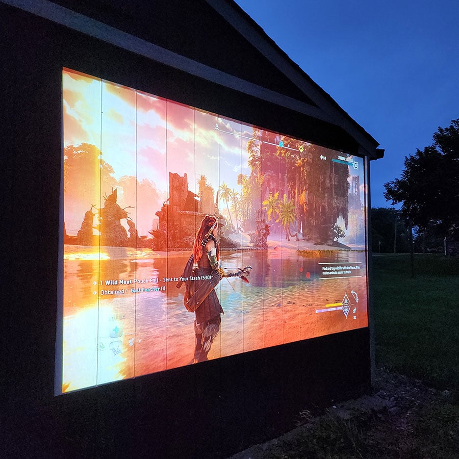 Outdoor projector screen paint on wooden projection surface